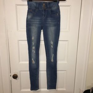 Mid rise distressed skinny jeans